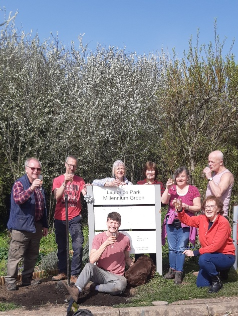 Volunteers celebrating the arrival of mains water at Liquorice Park 