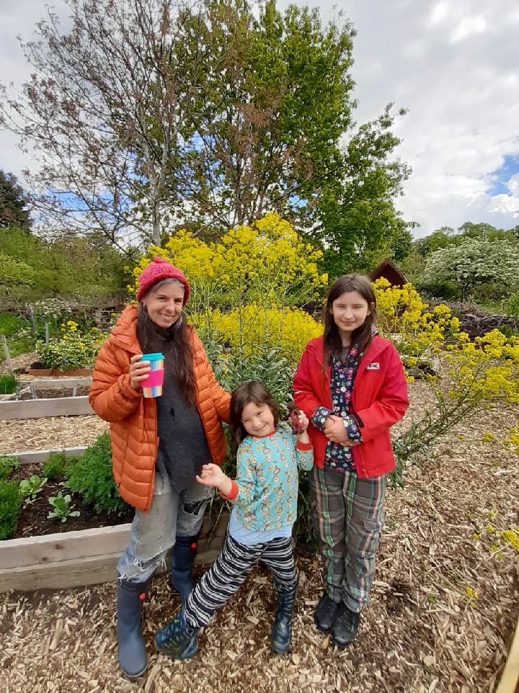 Some of our neighbours enjoying the Herb Garden with a backdrop of yellow flowering Woad 